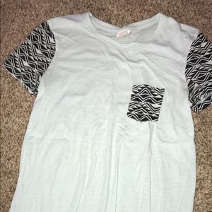 PINK teal t shirt with black geometric pattern